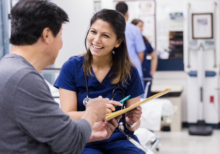 Nurse and patient reviewing paperwork